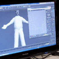Écran d'ordinateur qui affiche un logiciel 3D avec un personnage